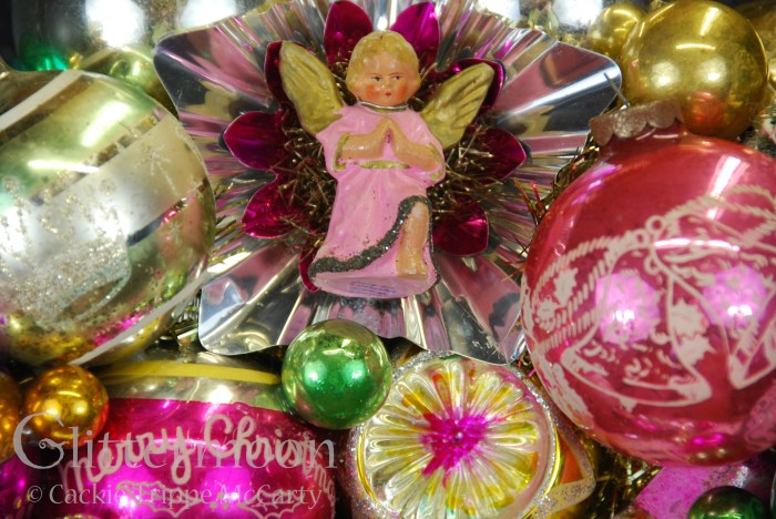 This chubby little angel has pride of place on top.