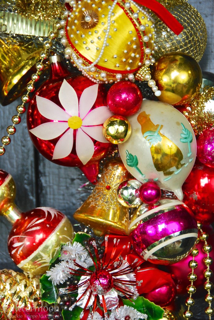 The right side is no slouch either.  It has a jumbo Poland teardrop with a big white flower painted on it.  Plus there is a gaudy (and I mean that in the best way) gold pin art ball as well as another Poland, another teardrop with a skier on it.