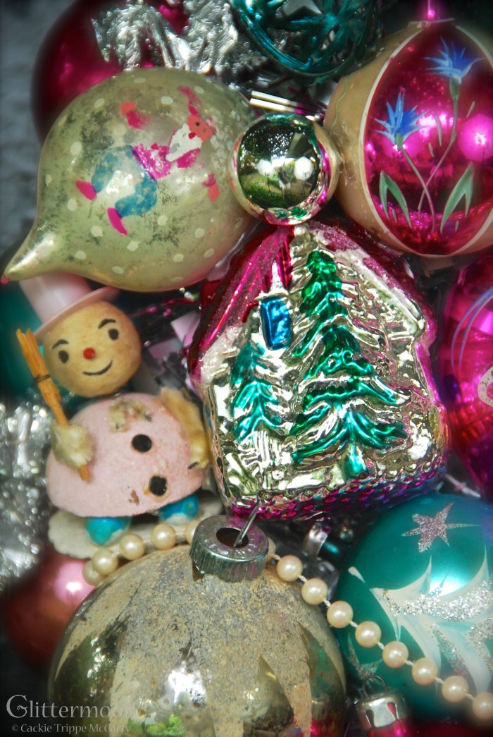 And, finally, I adore the little pink Japanese paper elf -he is too cute!  Notice also the wonderfully worn Poland ornie above it with the almost-worn-off  painted elf.